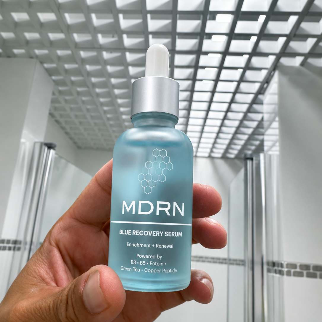 MDRN Blue Recovery Serum held in hand